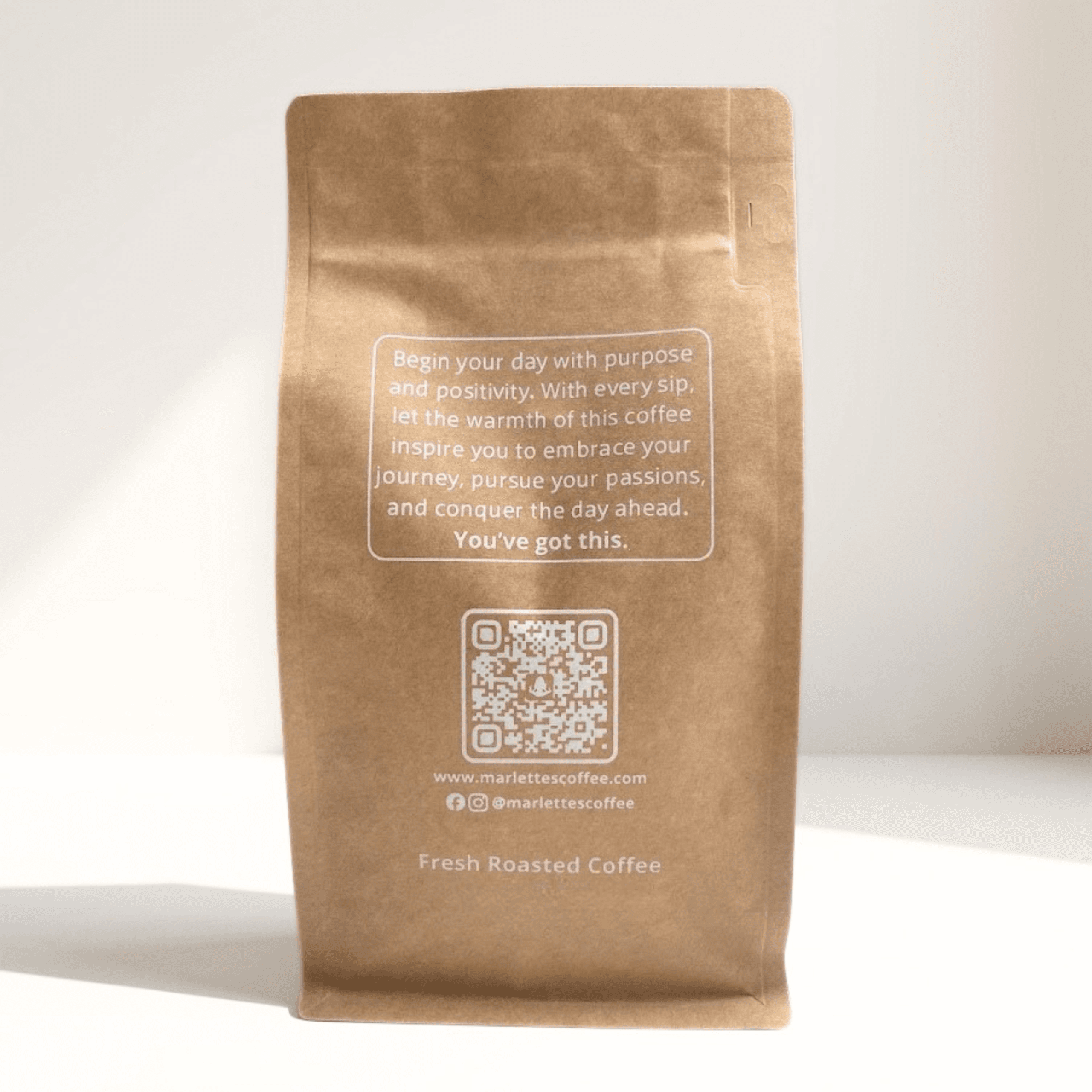 Back of a Marlette's Coffee bag with an inspirational message and QR code